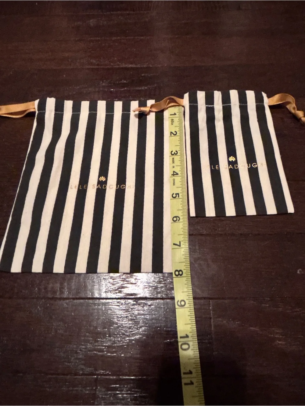 Lele Sadoughi Black and White Striped Drawstring Pouches with Gold Logo